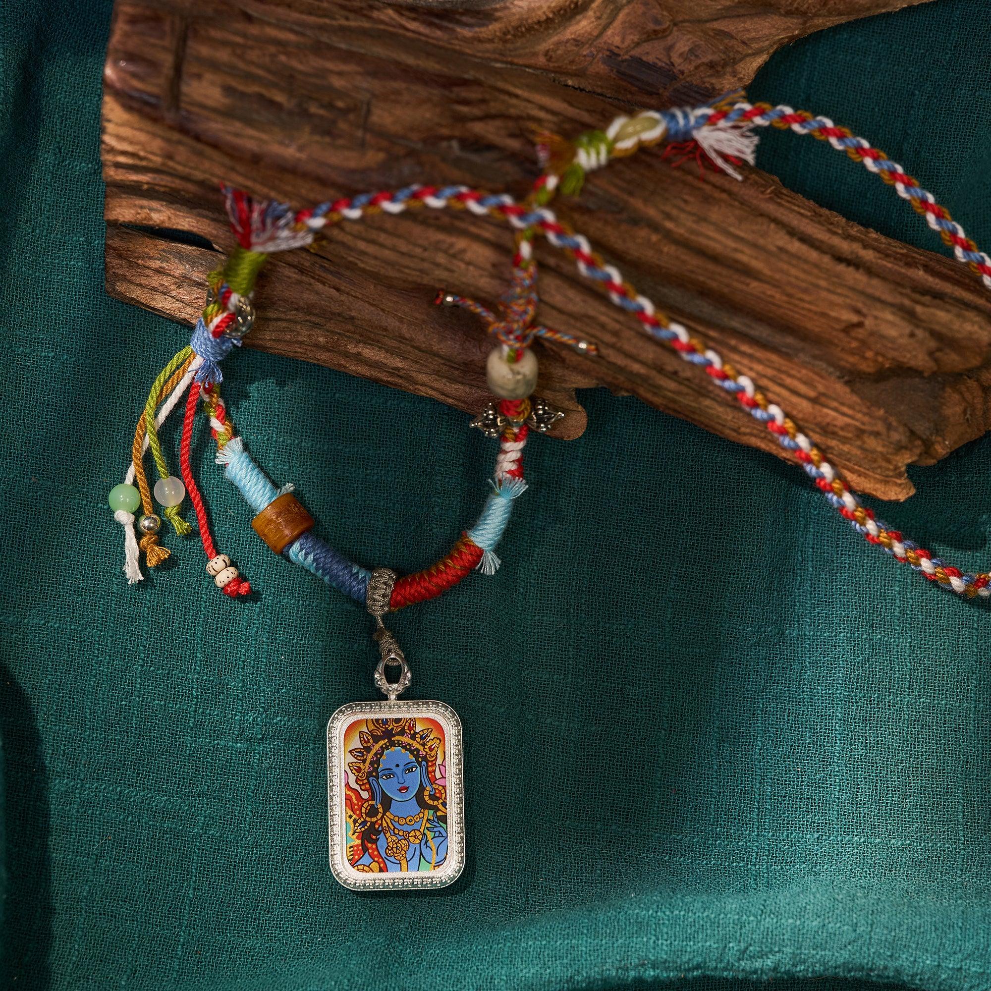 Handcrafted Tibetan-style necklace with colorful braided cord and a rectangular deity pendant