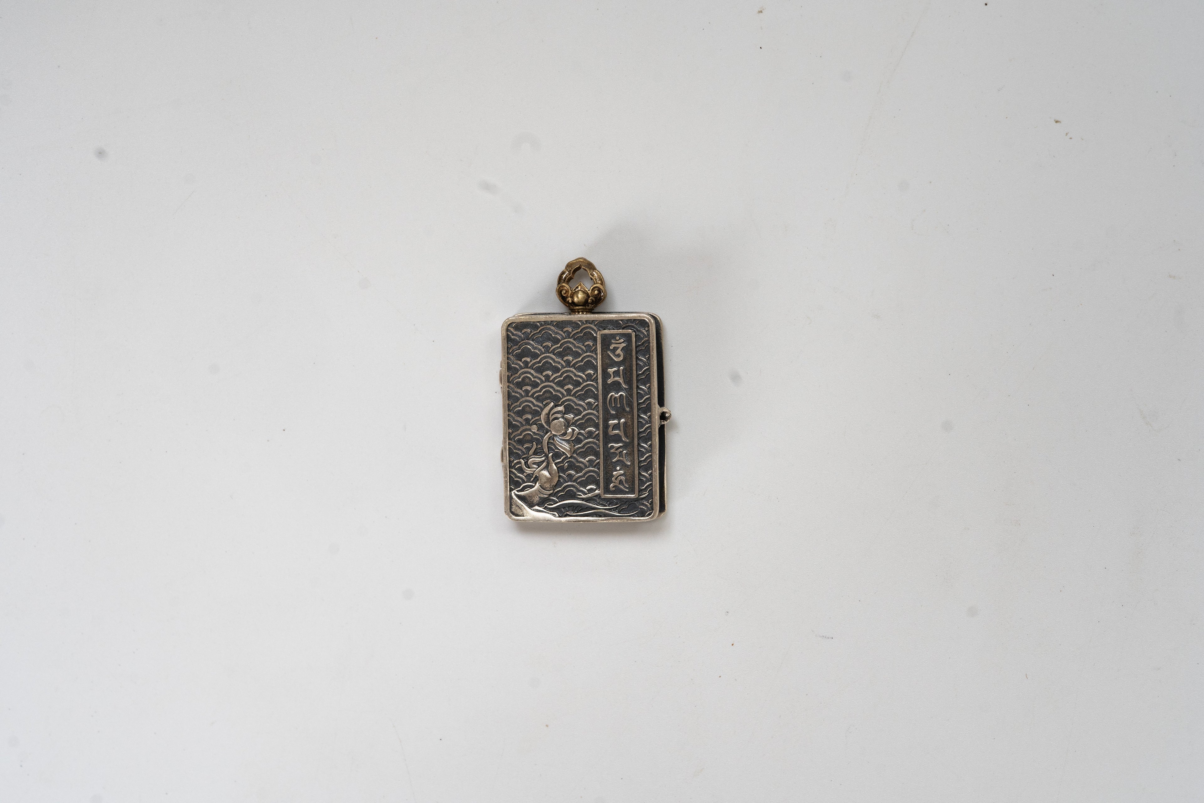 Tibetan Silver Scripture Pendant · Openable Yellow Jambhala Blessing