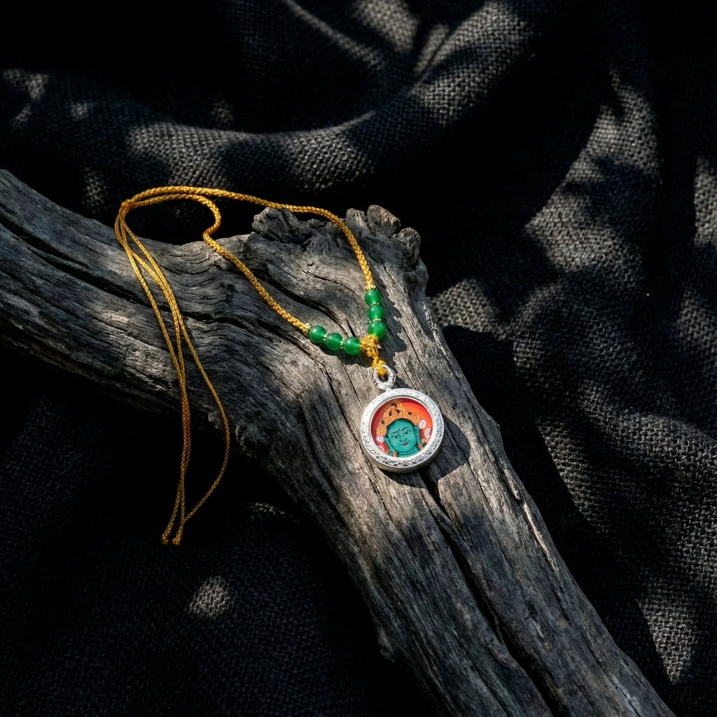 Handcrafted Buddha pendant necklace with green beads on yellow cord, spiritual jewelry on wood