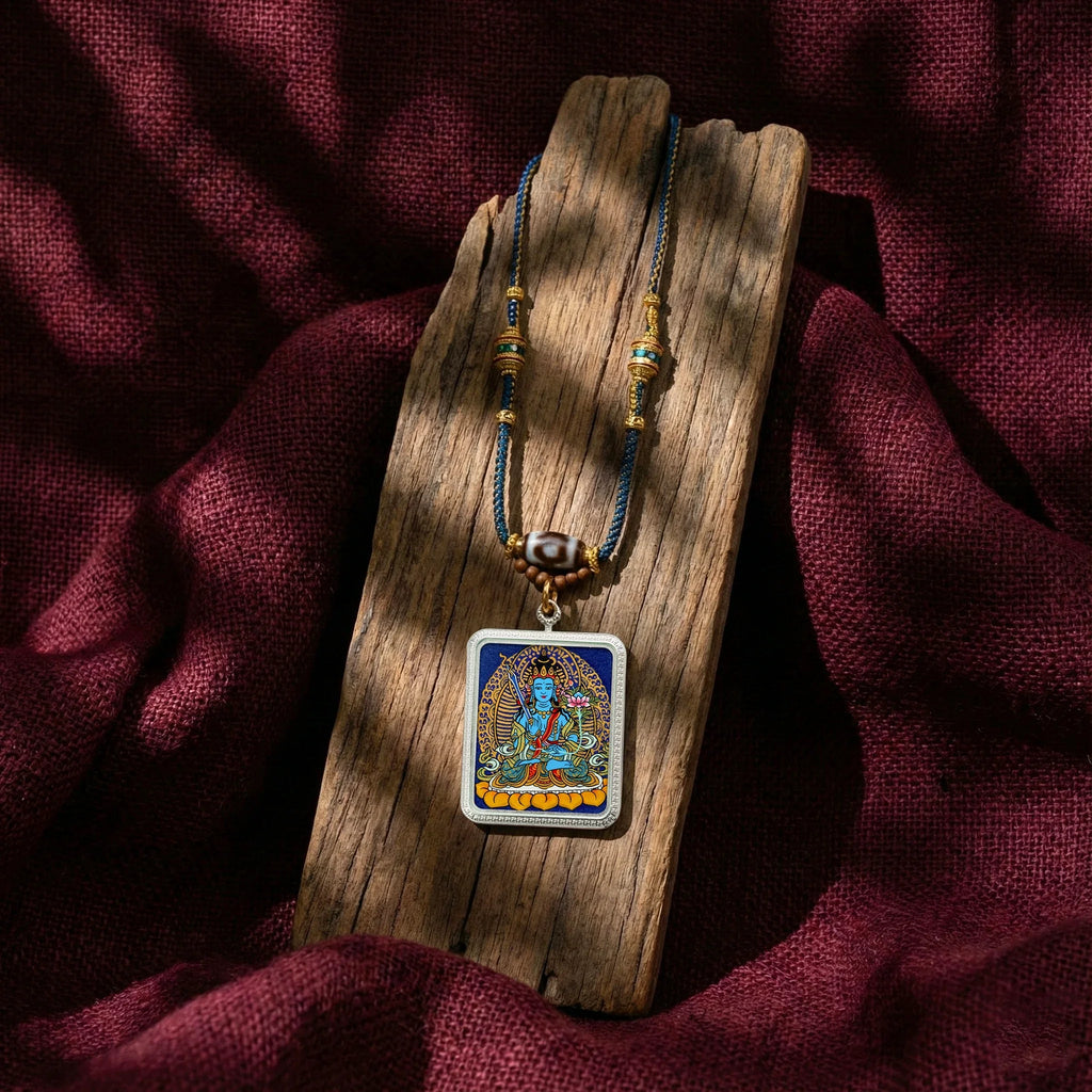 Tibetan style pendant necklace with deity artwork on wood, spiritual jewelry display