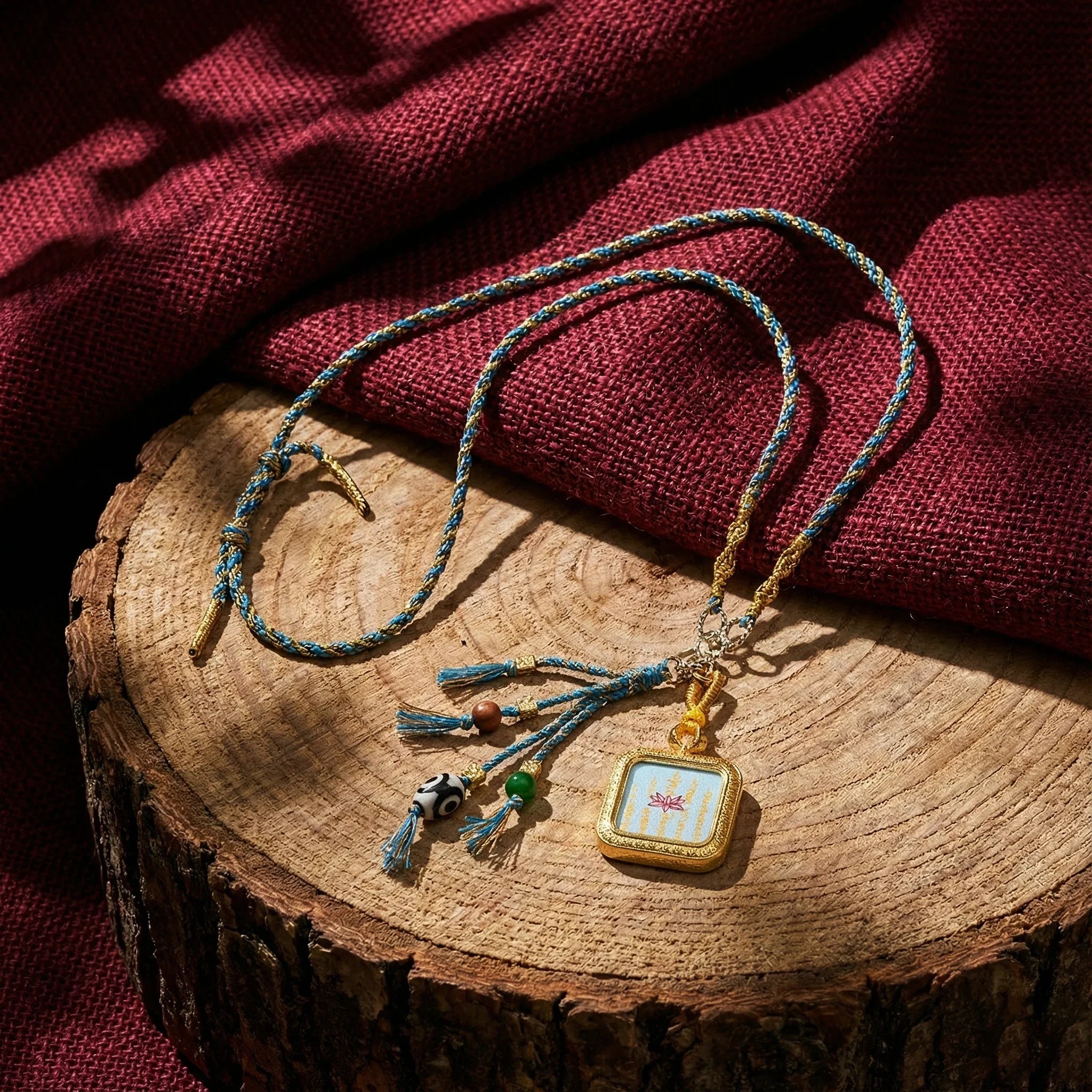 Handwoven Himalayan style pendant necklace with colorful beads and tassels on wood slice